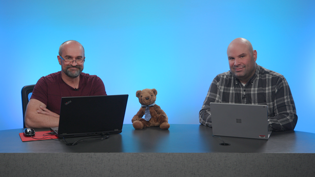 Shot of Peter Myers, Chris Finlan and Paginated Report Bear at a desk